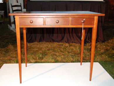 Eldress Rosetta Stephens of the North family at New Lebanon used the figured cherry work table, circa 1840, that sold for $58,500.