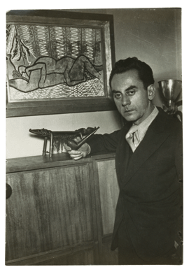 In this "Self-Portrait†around 1934, Man Ray depicted himself as an intense, even brooding, figure, standing in front of assorted art objects. He was, in fact, a hard worker with a great sense of humor and adventure, who made lasting contributions to the development of Modernism and to appreciation of African objects as works of art. This silver gelatin print is from the collection of Camillo d'Afflitto, New York. ©2009 Man Ray Trust/Artists Rights Society, NY/ADAGP, Paris.