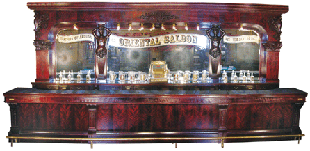 Front and back bar with original matching liquor cabinet by Brunswick, Balke & Collender Co., sold for a record $302,500, a top lot in the sale.