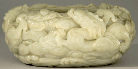 The celadon jade bowl was imperial, carved with five clawed dragons and clouds, and sold to the Chinese trade for $58,650.