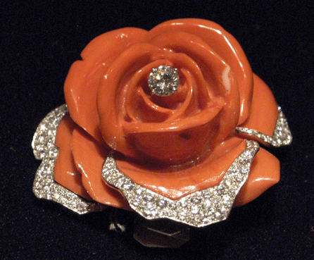 Pat Saling, New York City, offered a Cartier Paris carved coral brooch, circa 1960, trimmed with diamonds.