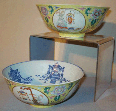 Pair of yellow and blue glaze decorated matching bowls, with other colors, sold at $2,645. 