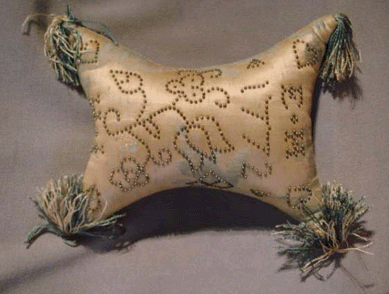 Interesting and rare silk marriage pillow, dated 1772, decorated with tulip flowers and hearts sold at $1,725.