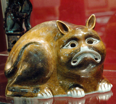 A whimsical Chinese cat "night light†displayed at Philip Suval Inc, Fredericksburg, Va., was made at the end of the Eighteenth Century to keep mice and rats away.