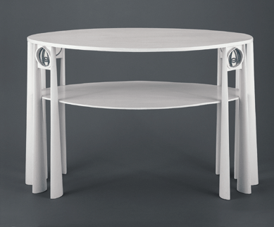 Painted white, this wooden table from 1902 is by Charles Rennie Mackintosh. It has inclusions of clear and opaque leaded glass inserts. Collection of the Art Institute of Chicago.