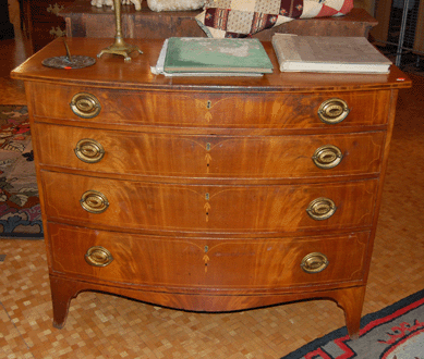 The Massachusetts Sheraton bowfront chest was attributed to Abiel White of Weymouth and fetched $5,520.