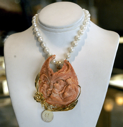 A standout at Kainaros Jewelry, Emerson, N.J., was this carved coral and pearl necklace, circa 1940s.