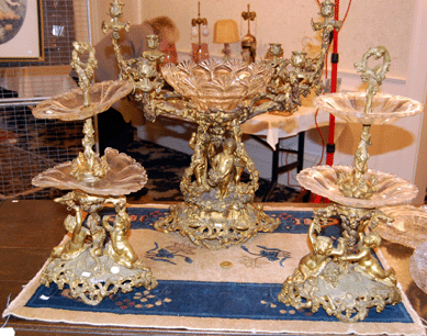 A late Nineteenth Century gilt bronze garniture set went to the phones for $19,550.