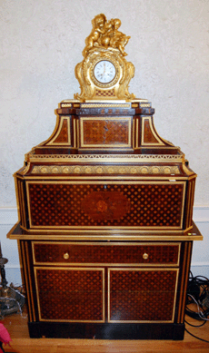 The music cabinet was made in Louis XV style with a rococo clock and sold on the phone for $12,650.