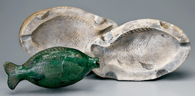 The small fish bottle with detailed scales and fins has well-defined eyes.