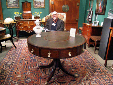 George Subkoff of George Subkoff Antiques, Westport, Conn., with the Dickens rent table.