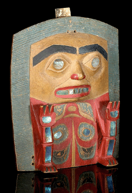 A collector paid $146,000 for a Haida frontlet carved in bold and shallow relief on the front, depicting a seated figure with raised hands, the body worked in schematic fashion, with abalone insets throughout.
