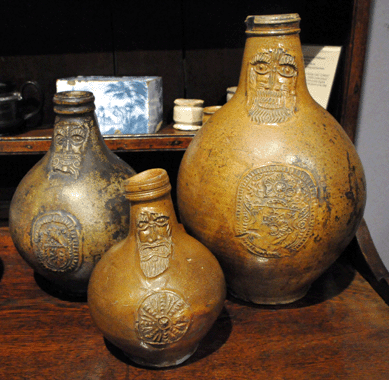 From the collection of early stoneware offered by Winsor Antiques, Southport, Conn., the Frechen bellarmine jugs date from the first half of the Seventeenth Century.