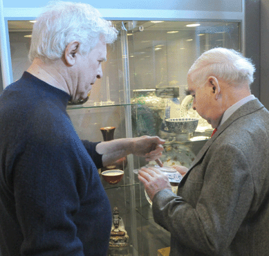 Peter Rosenberg, left, Vallin Galleries, Wilton, Conn., chats with a client on opening day.