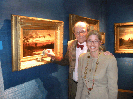 Alex and Laurel Acevedo with the painting by Jasper Francis Cropsey, complete with metal tag. ⁒. Scudder Smith photo