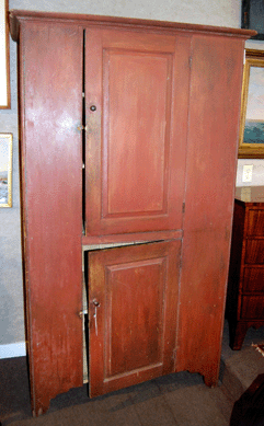 The two-door country cupboard in old red paint from a Hanover, N.H., family may have been the deal of the day when it brought $2,473.