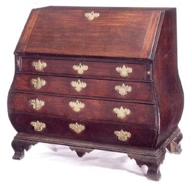 Chippendale figured mahogany bombé slant front desk, Marblehead, Mass., circa 1770, brought  $698,500.