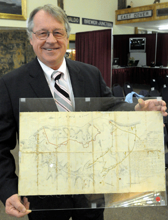 Auctioneer James Julia with the $1.15 million map from the Battle of Yorktown.
