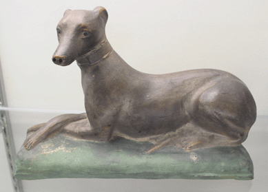 The top lot of the redware figures came as a rare molded whippet with later paint decoration that was marked John Bell sold for $14,950.