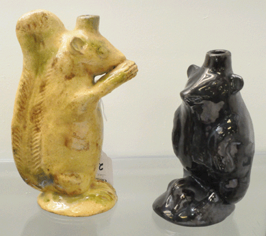 The rare Moravian squirrel bottle attributed to Rudolph Christ, Salem, N.C., sold at $15,525. A rare Moravian bear form bottle, also attributed to Christ, realized $9,775.