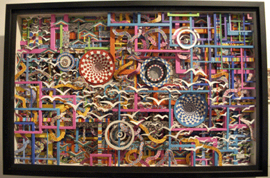 An obsessively complex and colorful paper sculpture shadowbox by Haint (Allen Wayne Bradley) was on view at Rising Fawn Folk Art, Lookout Mountain, Tenn. The shadowboxes take from one month to eight months to complete.