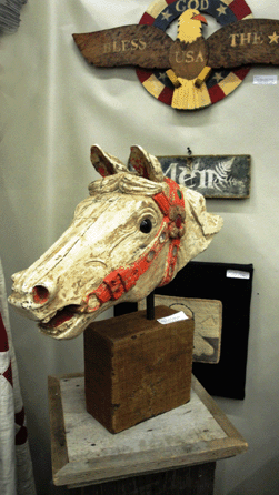 From Timber River Farm, Timber River, New Brunswick, Canada, came this late Nineteenth Century carved wooden carousel horse head. With original paint and great detail, it was priced at $1,175.