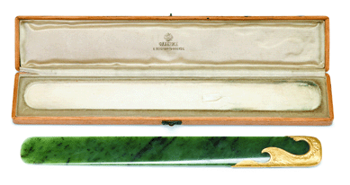 This Faberge gold-mounted spinach jade page turner by workmaster Michael Perchin fetched $20,000.