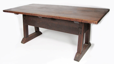 A Gustav Stickley oak director's table, circa 1912, with pegged construction, a branded red mark and the original surface brought $12,650.
