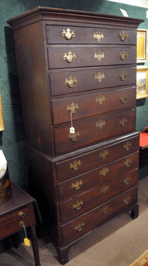 An American cherry Chippendale chest-on-chest in a wonderful old finish did well, selling at $6,500. 