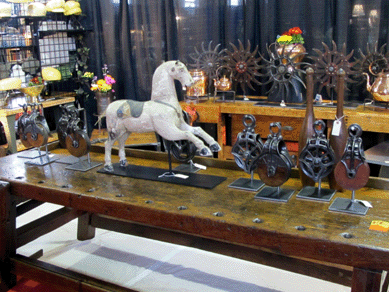 Eye candy and a wooden horse atop early carpenter's workbenches at Bonkey's Treasures and Wonderful Finds, Hellertown, Penn.