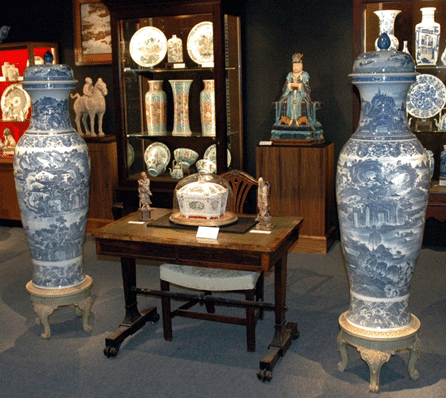 A pair of large Chinese blue and white porcelain "soldier†vases, ex-collection Henry Clay Frick, was prominently shown in the gallery's booth at the Winter Antiques Show in 2009. The early Nineteenth Century vases on finely carved wood bases are decorated with landscapes and seascapes; the borders feature crashing waves.