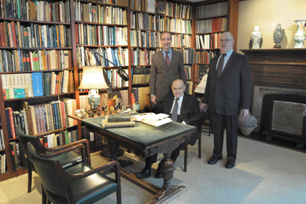 Pictured at this antique desk †a mainstay of the gallery's private office in various locations over the years since almost the beginning †are gallery president Allan Chait, seated, and his sons, Steven, left, and Andrew. Many a collector has sat at this very desk, discussing a potential purchase, including President Herbert Hoover, who once spied a window display of blue and white porcelain here. He told the Chaits he would take "it,†and when they asked which piece he meant, he indicated he wanted the whole display.