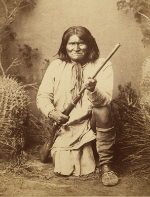 Posed with rifle and a wary expression, Apache leader Geronimo looks every inch the fierce adversary he had become. For more than 30 years, he fought to protect his traditional way of life and removal to a reservation. His legendary status lives on to this day. Photo by A. Frank Randall, circa 1887. National Portrait Gallery.
