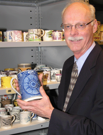 Richard in 2005 with Historic New England's collection of children's mugs. 