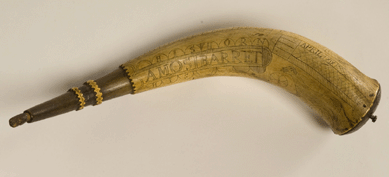 Amos Barrett's powder horn, Concord area, about 1775, cow horn, pine, gift of Frederick S. Richardson, Peter H. Richardson and Joan R. Fay. The owner of this horn, Amos Barrett (1752‱829), was at the North Bridge in Concord on April 19, 1775, and vividly recalled 50 years later what he saw and did that day. He saw the musket balls splash in the river, heard them whistle by his ears and saw Abner Hosmer and Isaac Davis slain by musket fire. His horn was later inscribed "XIX†in commemoration of the day. The powder horn descended through the Barrett/Stow/Eaton family and was donated to the Concord Museum in 1994. ⁄avid Bohl photo