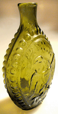 "A gutsy looking bottle†in "beautiful color,†the eagle/medallion flask, GII-8, in a brilliant yellow-olive coloration sold for $64,350.