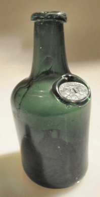 The free-blown Mt Vernon seal bottle in a deep green color brought $26,910.