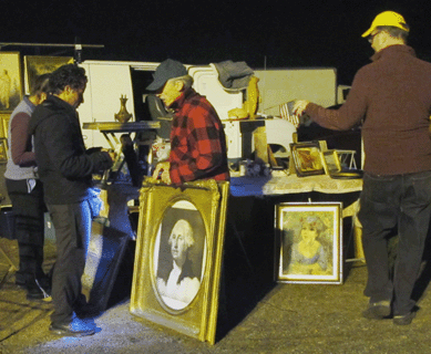 Charles Dorion, Biddeford, Maine, sells a wonderful frame as he and wife Francine set up for the market.