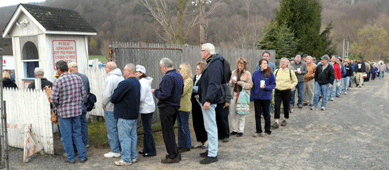 A long line of buyers waited to get into the market on opening day.