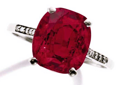 Ruby and diamond ring featuring a cushion-shaped ruby weighing 8.66 carats, flanked by single-cut diamonds weighing approximately .12 carat achieved $2,098,500.