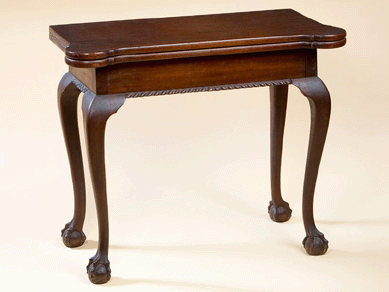 A diminutive New York Chippendale mahogany card table fetched $14,950 on the phone. 