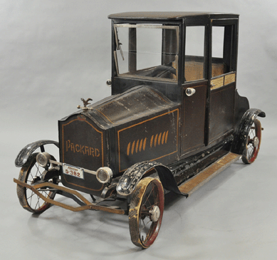 A circa 1924 American National Packard coupe pedal car with wicker-style door panels and eagle hood ornament finished at $43,700. 
