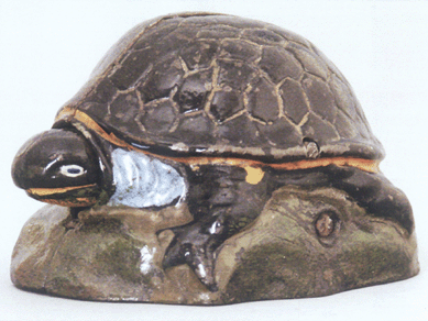 The "Turtle†bank, dubbed by its producer, the Kilgore Manufacturing Company, "Pokey the Turtle.†Many collectors refer to it as "the Holy Grail of all mechanical banks,†one with a manufacturing flaw that caused production to cease almost immediately; only nine examples are known. Listing a provenance of the Stan Sax collection, the bank sold at $70,500.