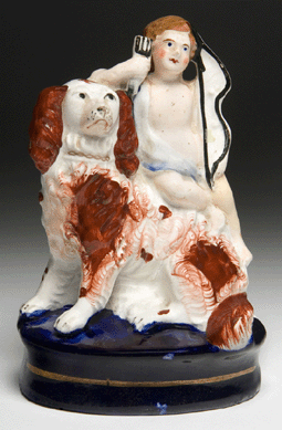 "Spaniel with Cupid,†circa 1855, Staffordshire, porcelain with glaze, maker unknown, Lora Robins Gallery of Design from Nature, University of Richmond Museums, gift of Fletcher Stiers.