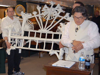 Constructed of birch root burls normally reserved for use as Penobscot Indian clubs, an imposing settee brought $26,450. Two companion chairs were $25,300.