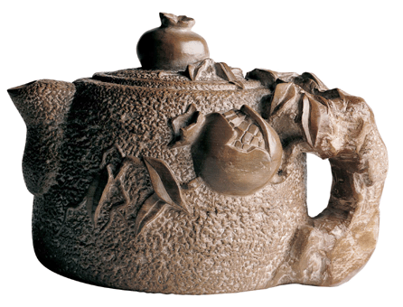 While imprisoned at Topaz, Utah, Homei Iseyama carved this complex teapot out of slate stones found in the area. After chipping out a rough form in a rock slab, he carved, sanded and polished the shape and design. Collections of Carolyn Holden, Aiko Iseyama and family, and Homei Iseyama and family.