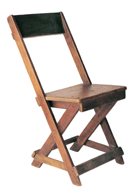 This is an example of a rudimentary chair made by Jack Yoshizuka of scrap lumber left over from building the camp at Topaz, Utah. Measuring 14 by 29 by 18 inches, it helped make up for the lack of furniture, except for cots, in assigned living quarters. Collection of the Japanese American Museum of San Jose.
