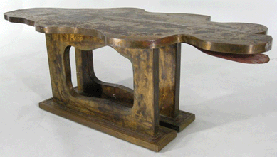 An amorphous figural sliding coffee table by Phillip and Kevin LaVerne, mid-Twentieth Century, went out at $6,300.