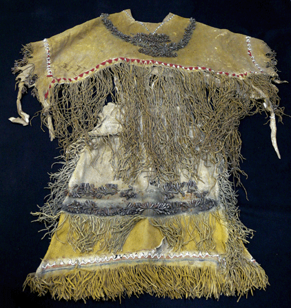 An Apache hide dress and mantle decorated with myriad tin jangles, multiple rows of long fringe, beadwork and painted designs was top lot at $13,200. 