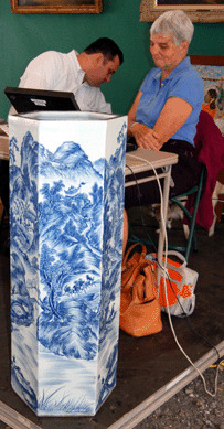 The pair of blue and white Chinese porcelain vases (one shown) culled $42,480.